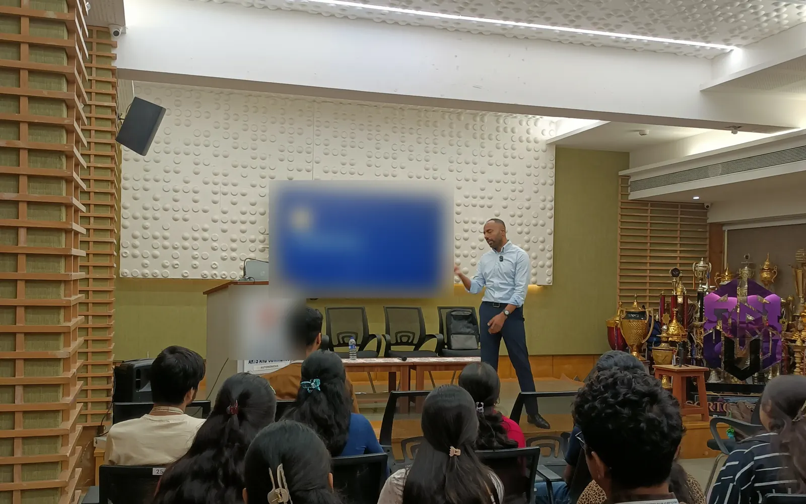 Praful S. Nair presenting to a hall of students at a live I'MREADY session